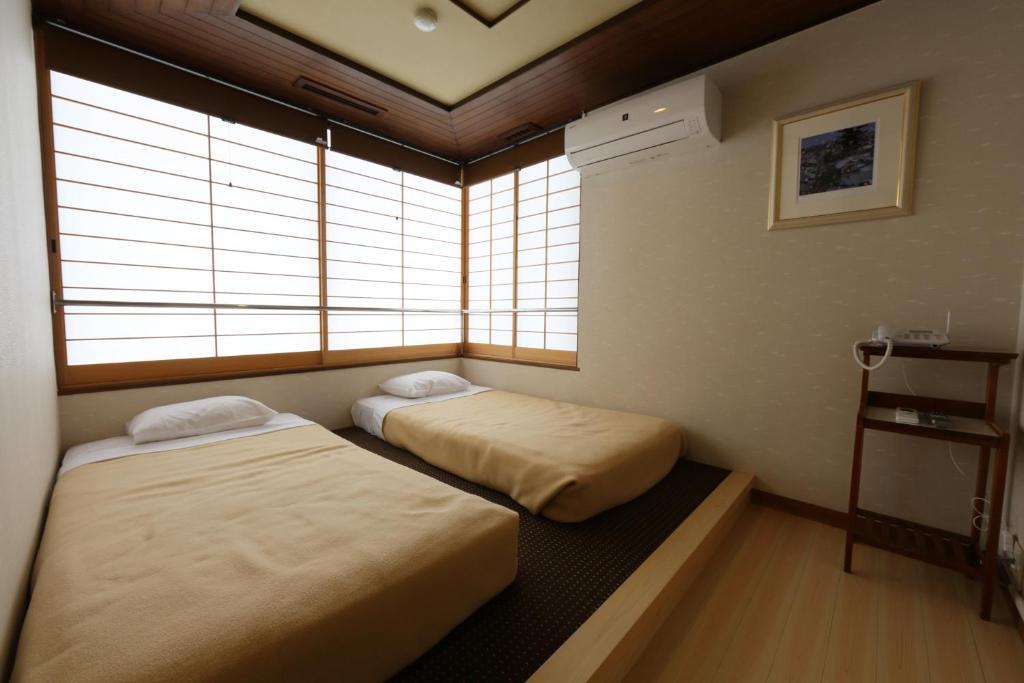 Tazuru Hotell Kyoto Rum bild